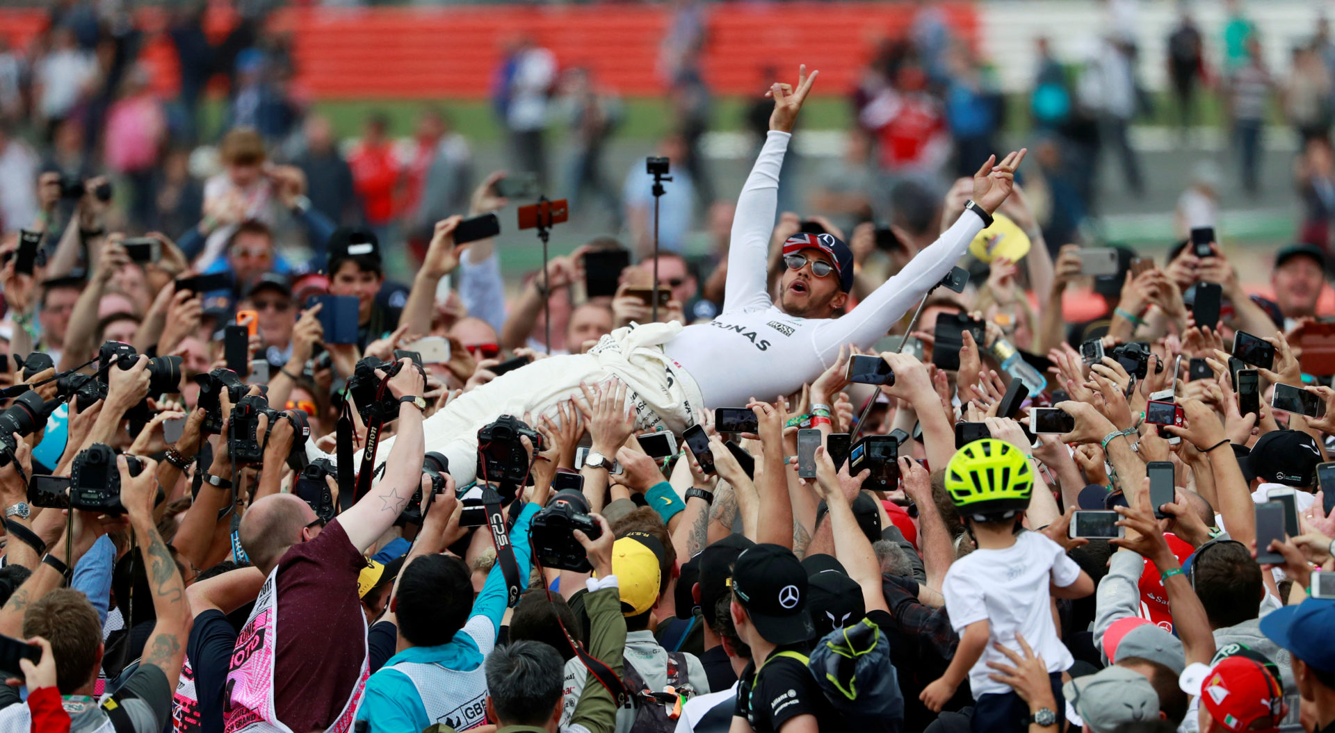 Mercedes' Lewis Hamilton celebrates his win with fans after the race at British Grand Prix 2017