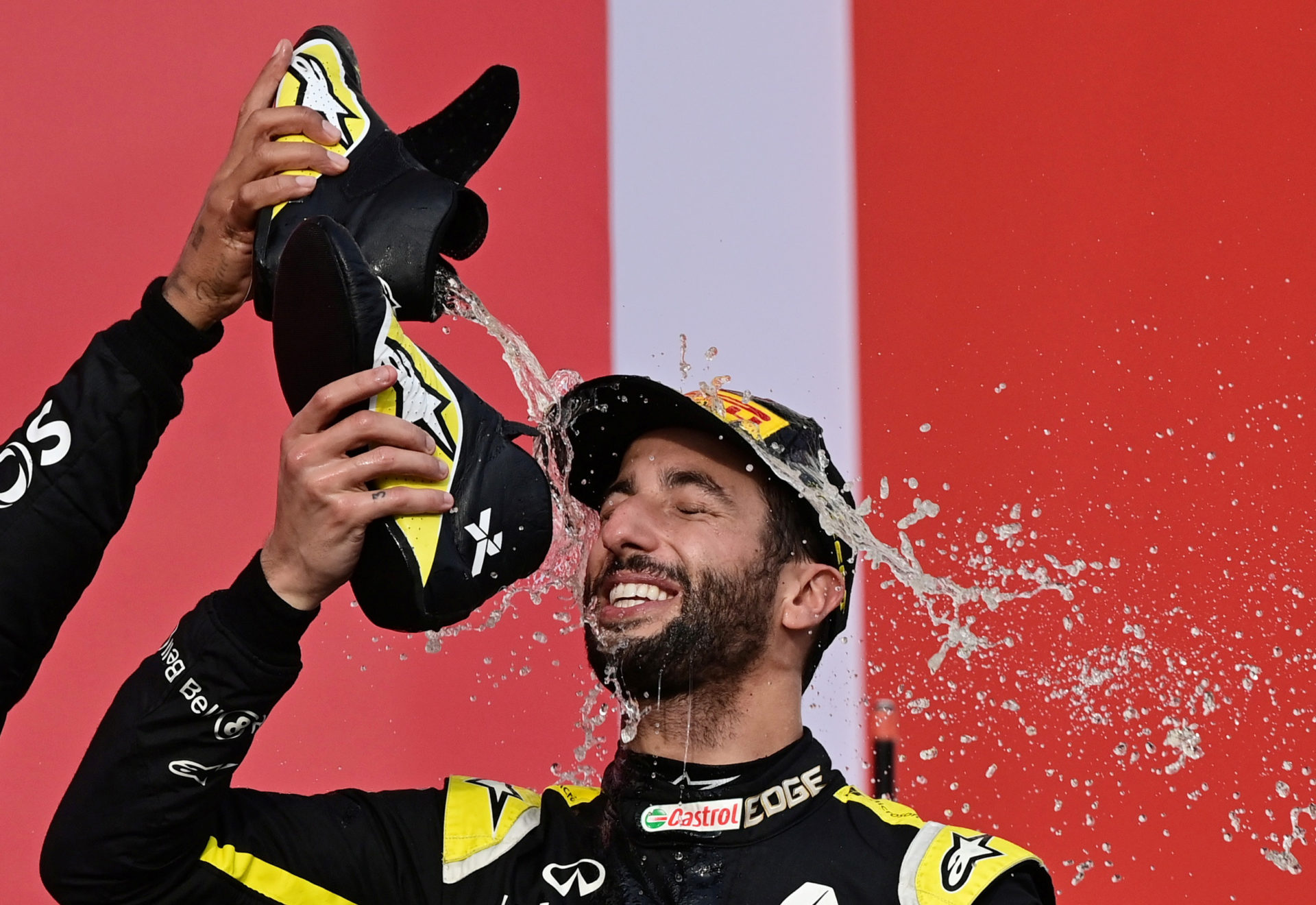 Daniel Ricciardo celebrating on the podium after the Emilia Romagna GP