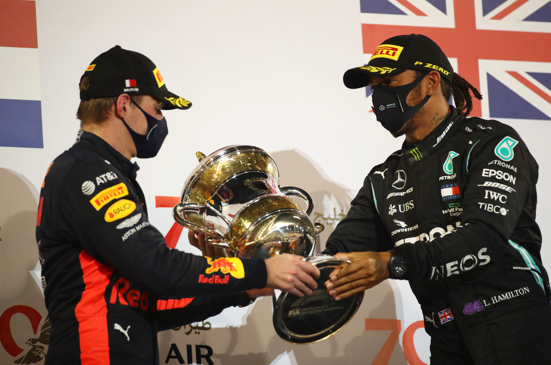 Lewis Hamilton allows Max Verstappen to hold his trophy