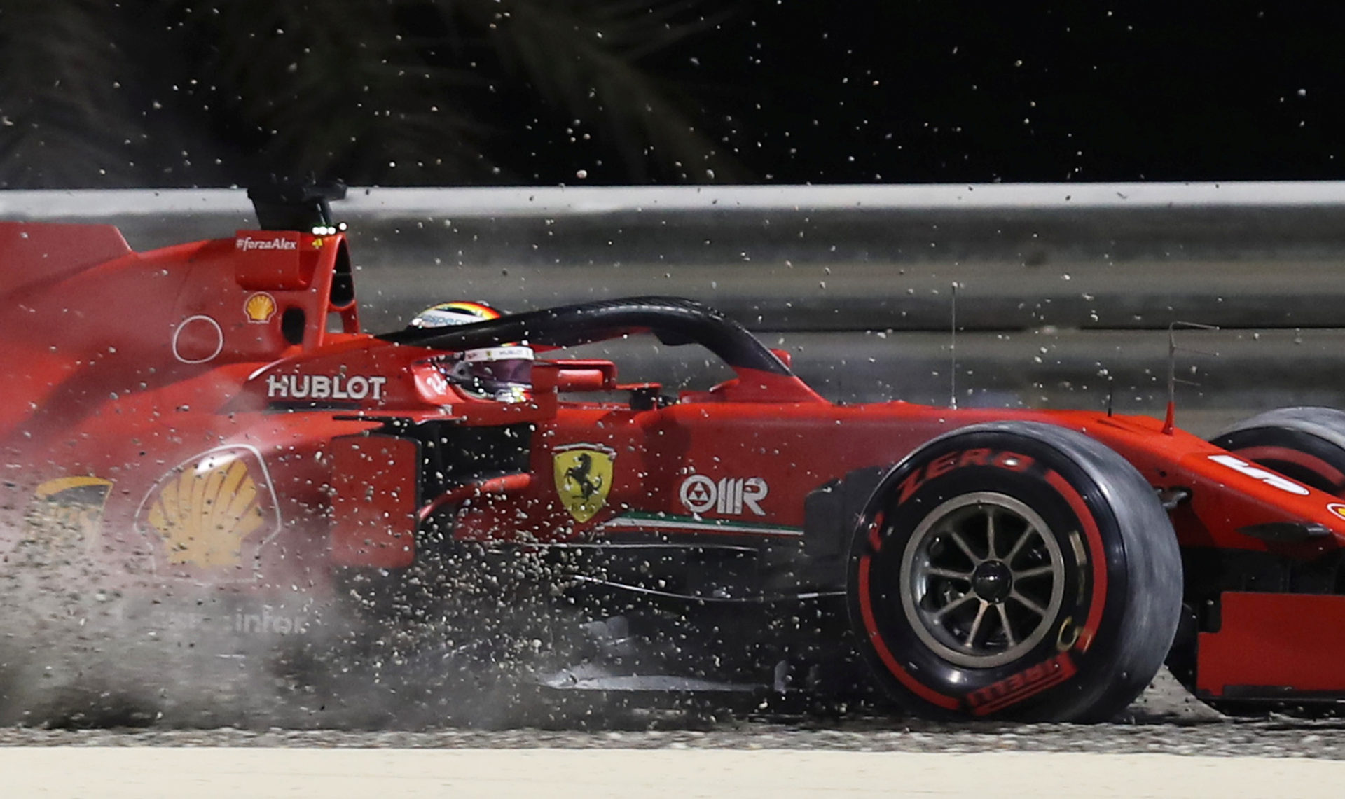 Ferrari driver Sebastian Vettel driving his Ferrari over gravel at Sakhir GP 2020
