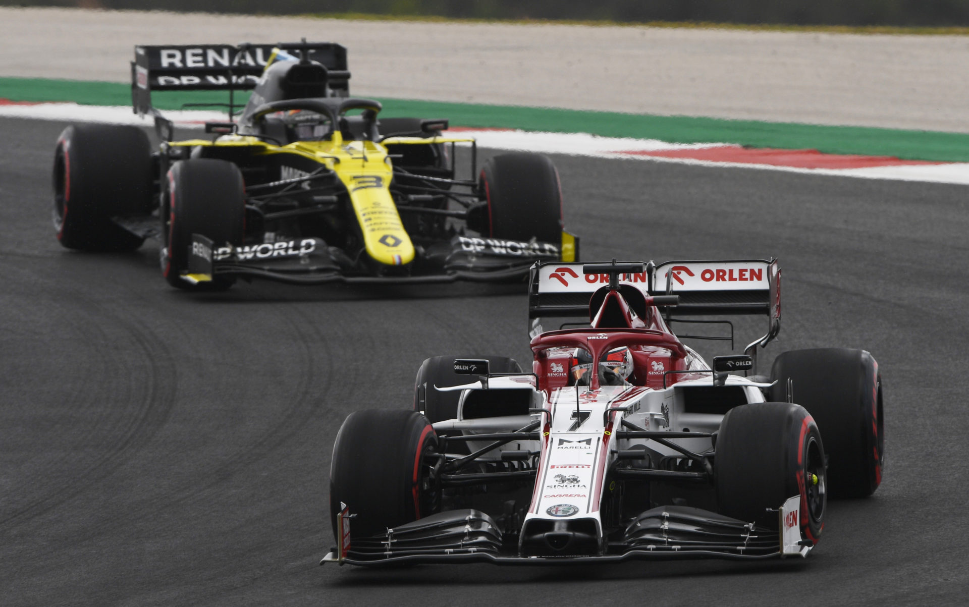 Alfa Romeo's Kimi Raikkonen does battle with Daniel Ricciardo at the Portuguese GP