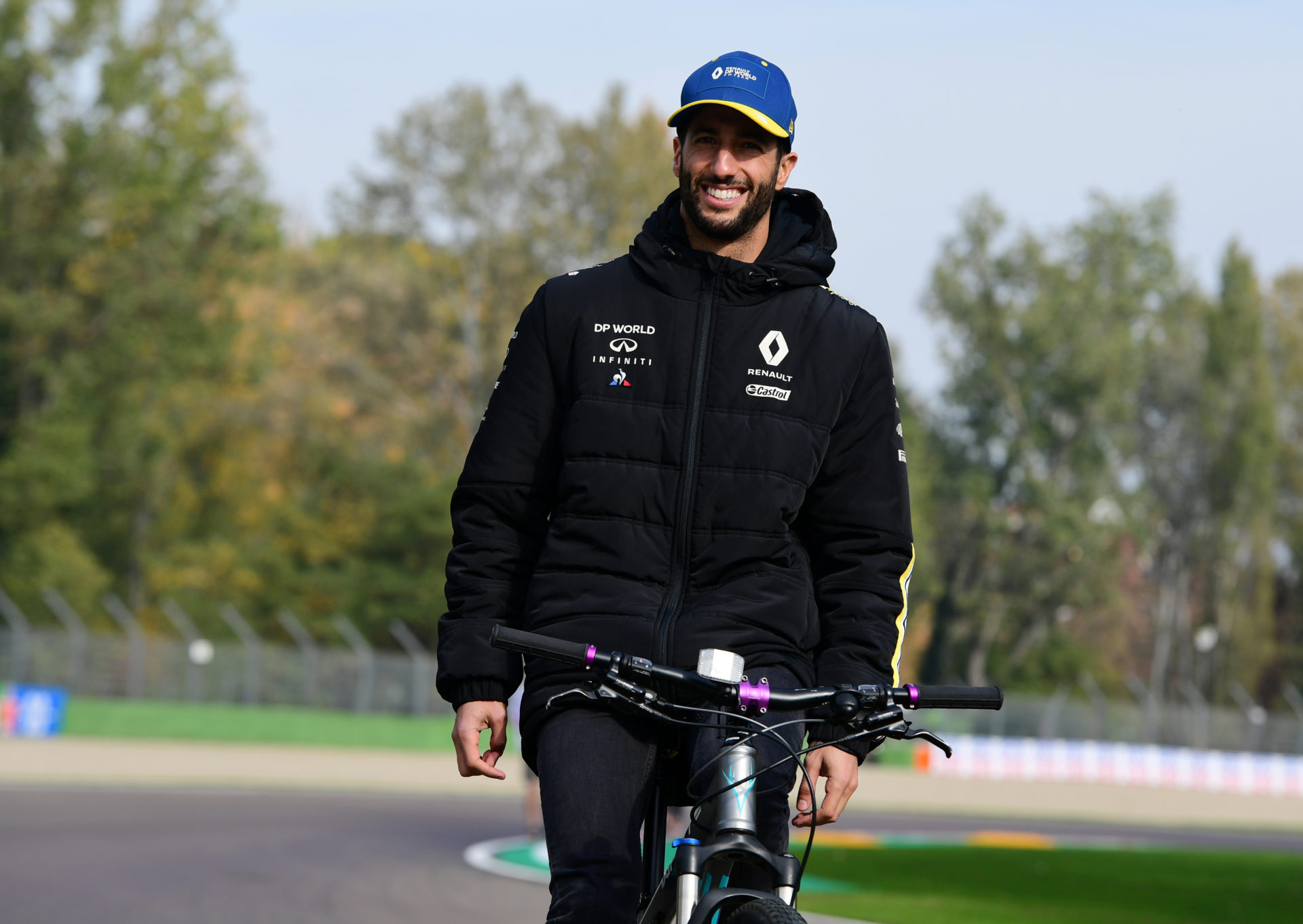 Daniel Ricciardo cycling at the Imola circuit