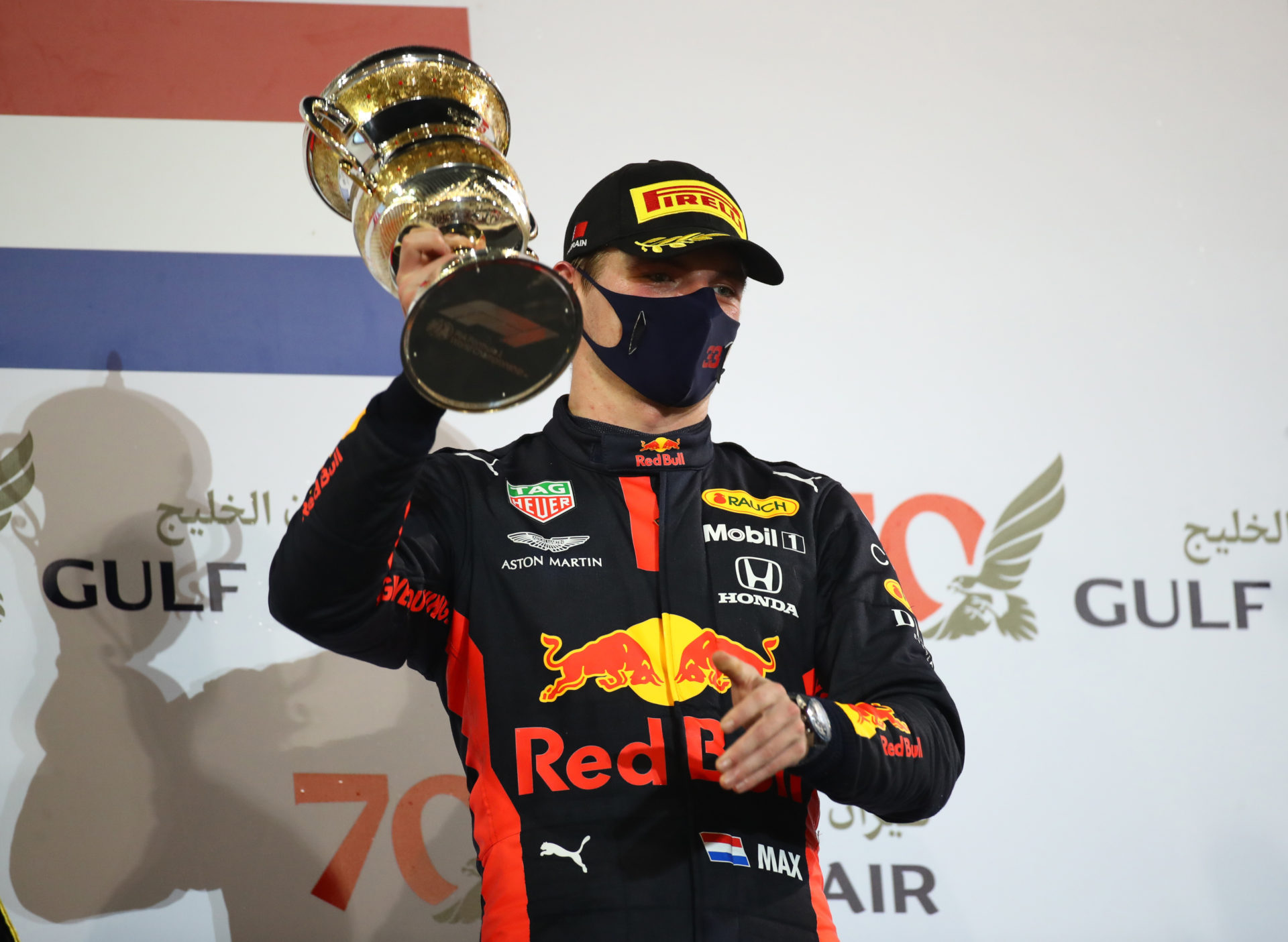 Max Verstappen holding his second place trophy at Bahrain GP