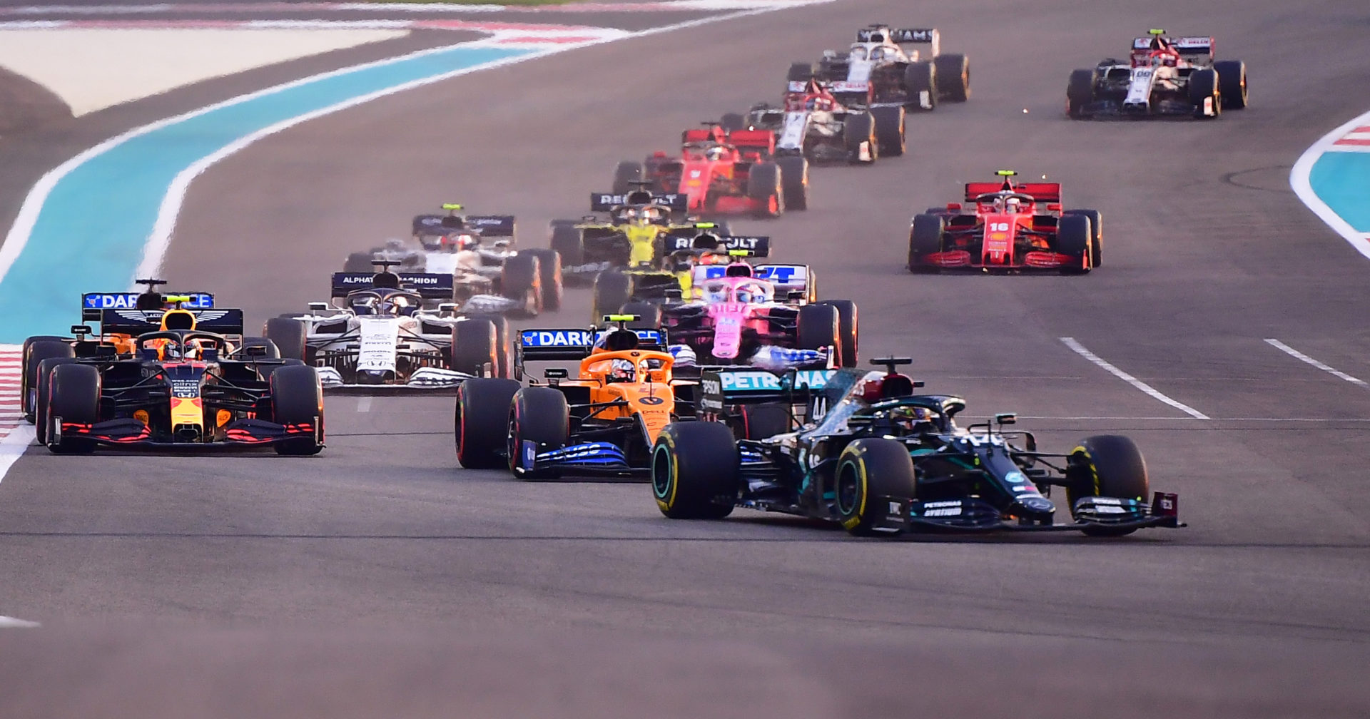 F1 grid at the Abu Dhabi Grand Prix, cars racing as per their line up with no abiding by no refueling guidelines made by FIA and F1 authorities.