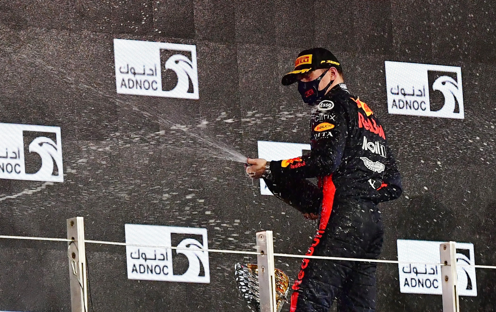 Max Verstappen sprays the champagne after his win in Abu Dhabi