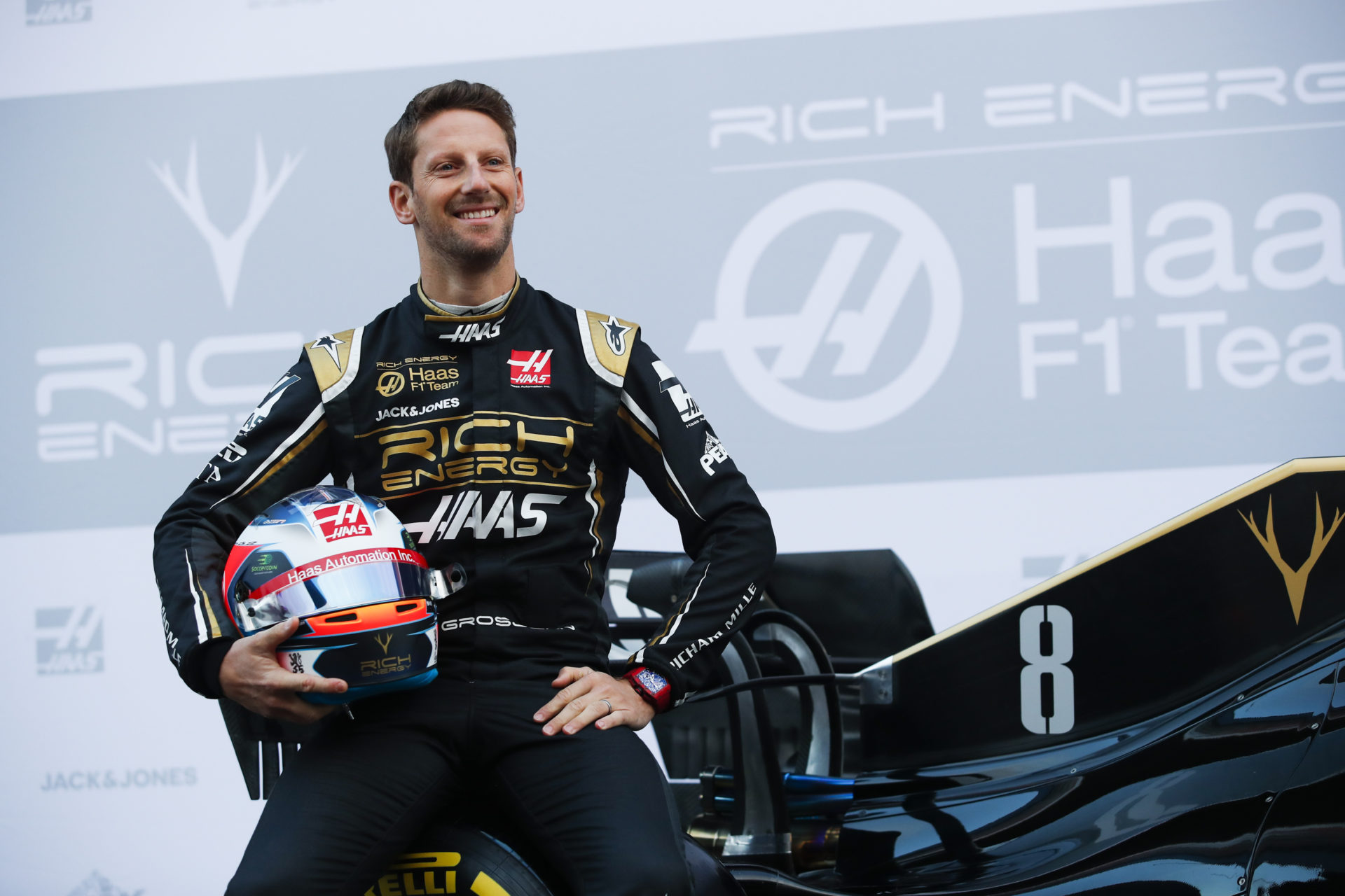 Romain Grosjean showcases his new helmet in testing at Spain