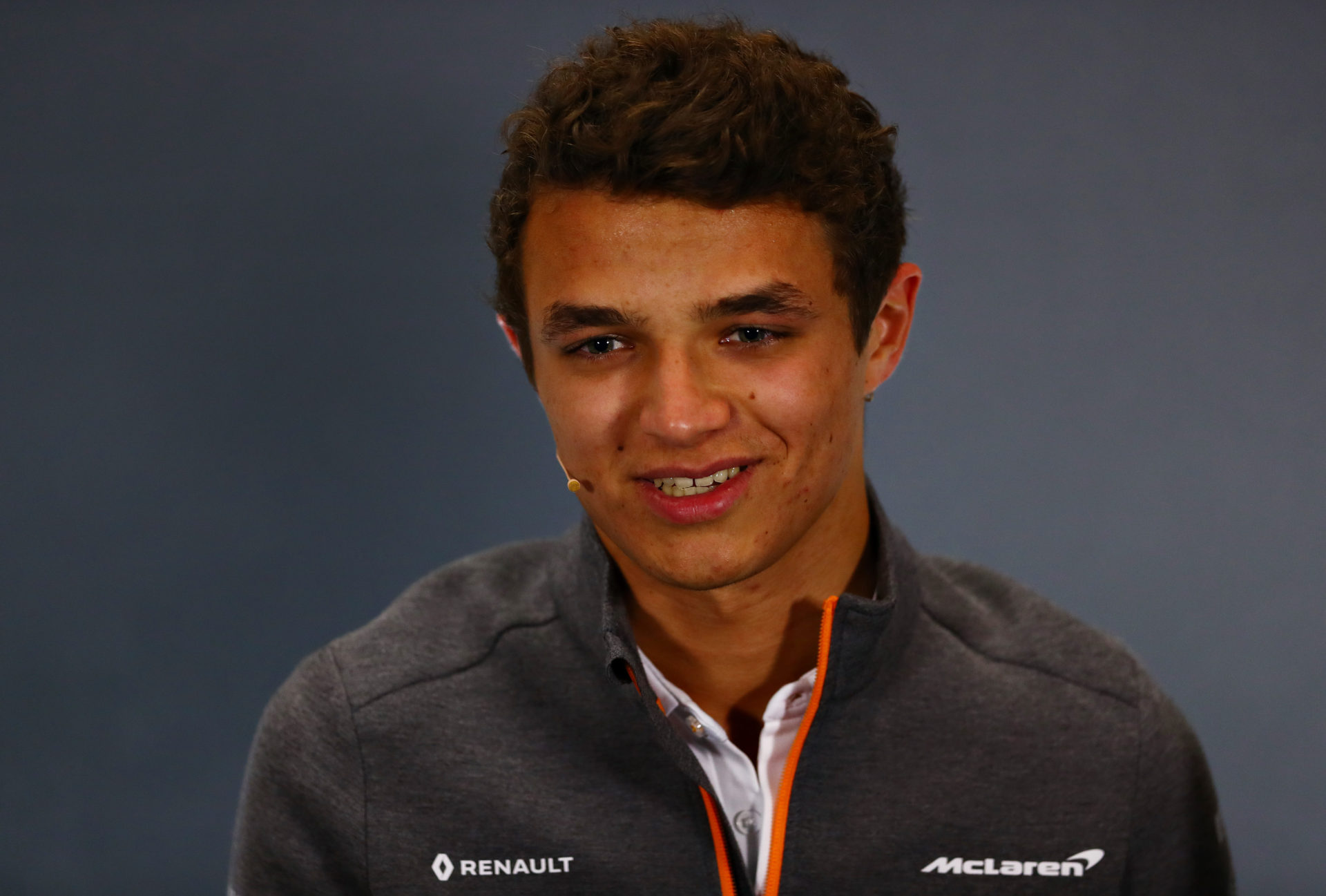 Lando Norris of McLaren offers a smile at a press conference