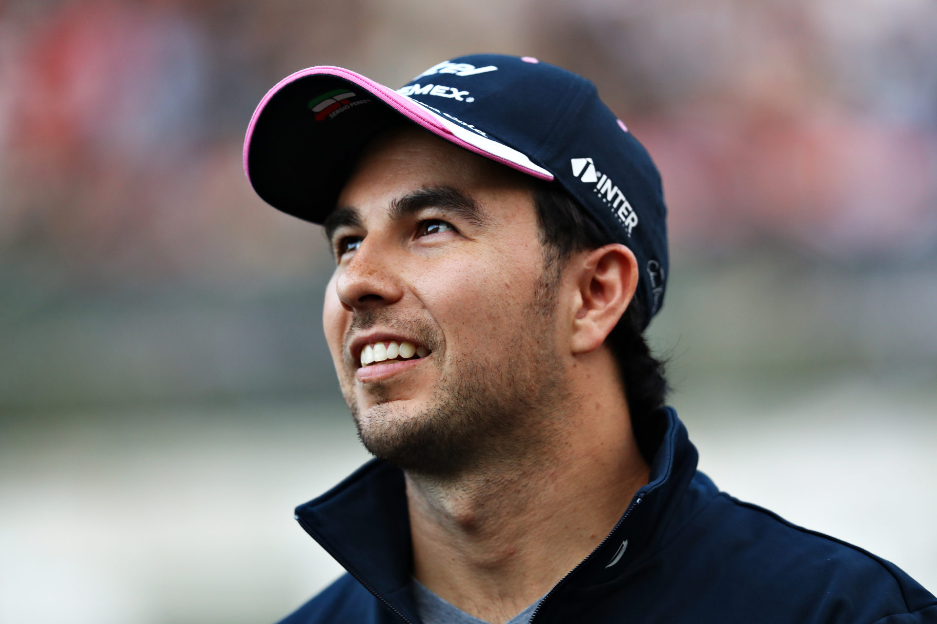 Red Bull driver Sergio Perez looks on with a smile in Japan