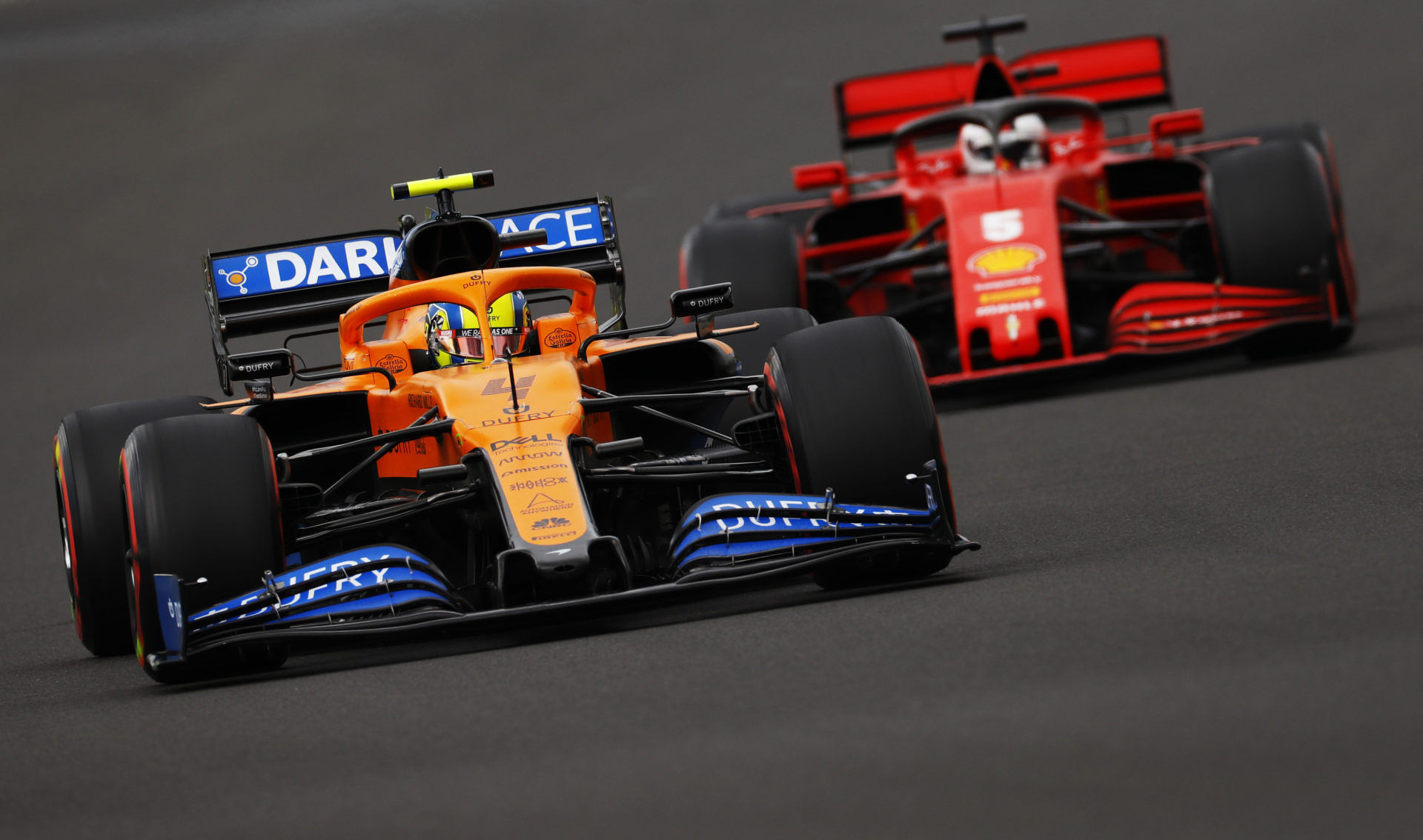 McLaren's :ando Norris battles Ferrari's Sebastian Vettel