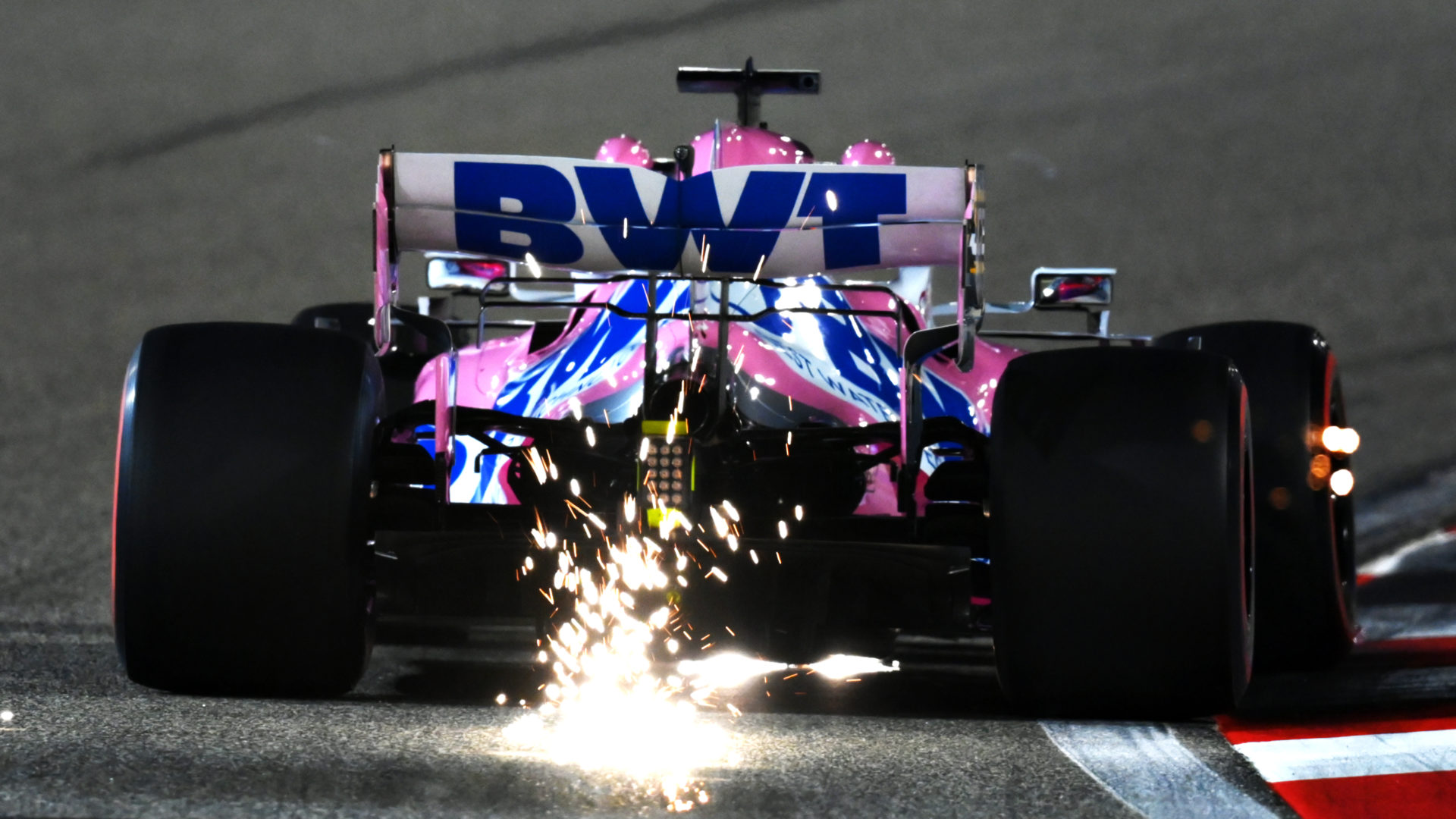 The Racing Point of Sergio Perez leavs sparks on the Bahrain circuit