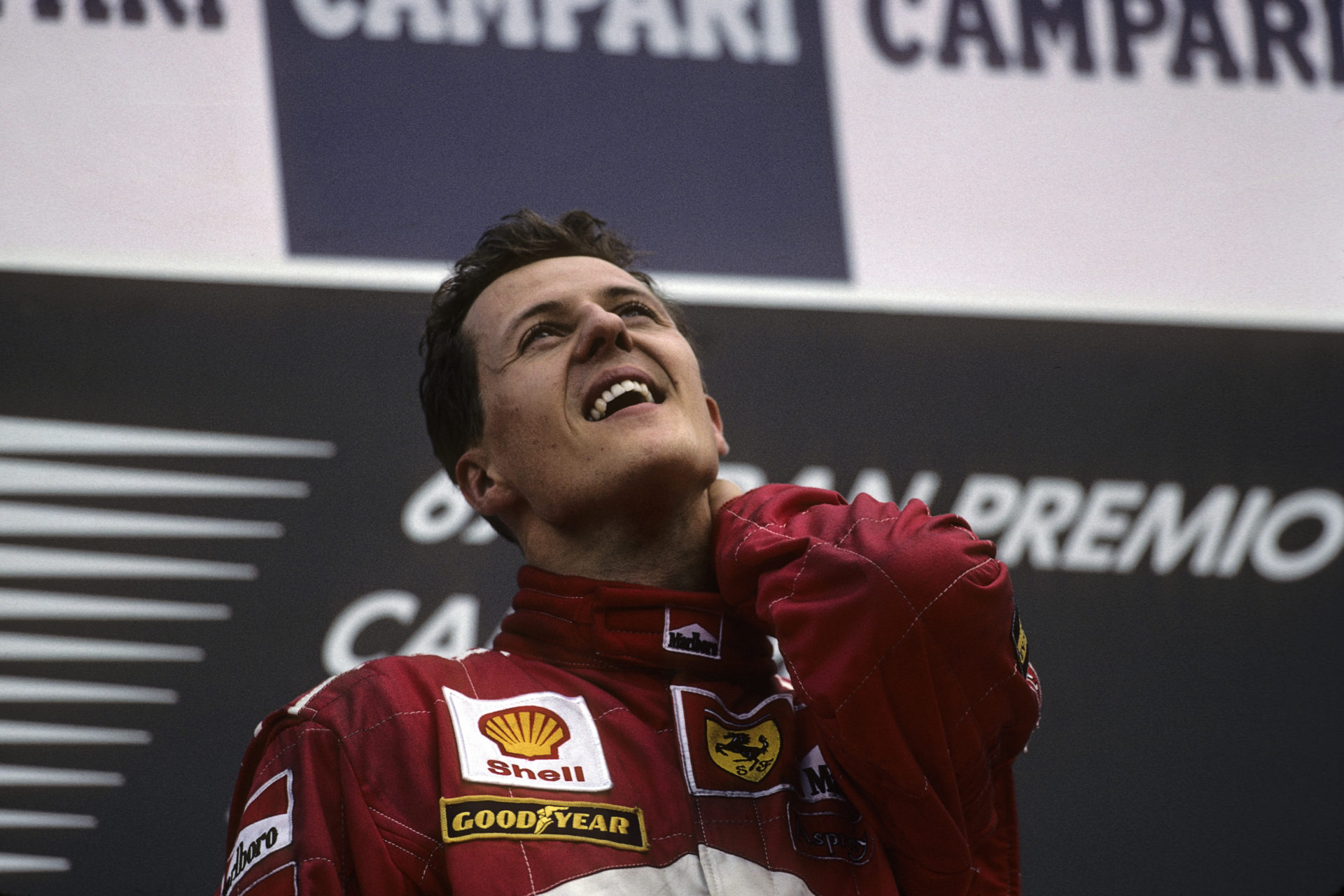 Michael Schumacher celebrates atop the podium after the race in Monza