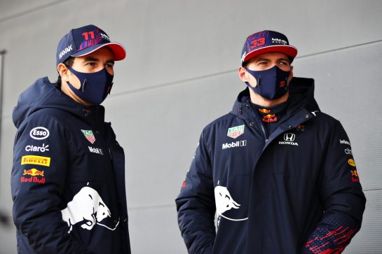 NORTHAMPTON, ENGLAND - FEBRUARY 24: Max Verstappen of Netherlands and Red Bull Racing and Sergio Perez of Mexico and Red Bull Racing talk in the Pitlane during the Red Bull Racing Filming Day at Silverstone on February 24, 2021 in Northampton, England. (Photo by Mark Thompson/Getty Images for Red Bull Racing) // Getty Images / Red Bull Content Pool // SI202102240201 // Usage for editorial use only //