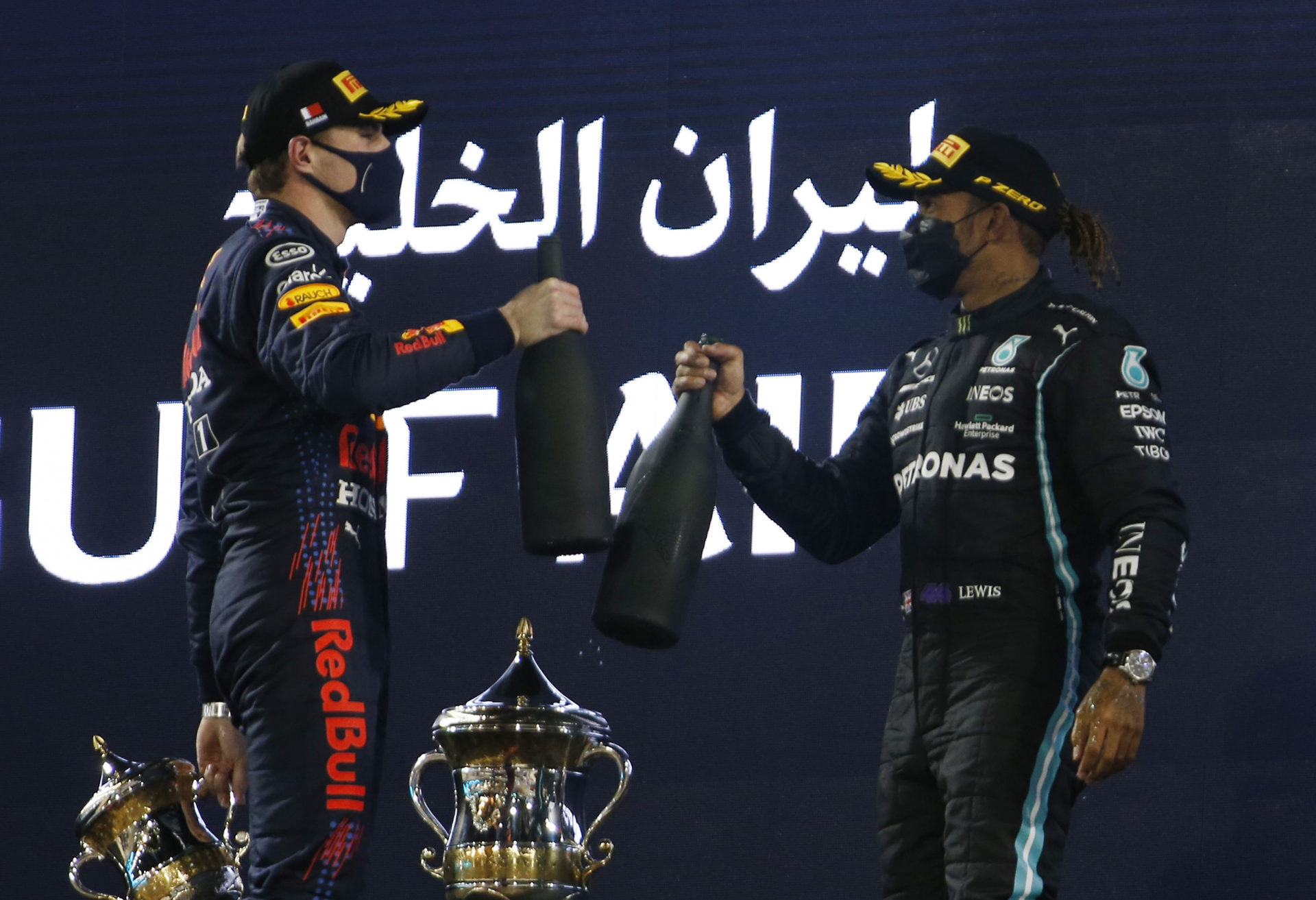 Lewis Hamilton and Max Verstappen celebrate their podiums