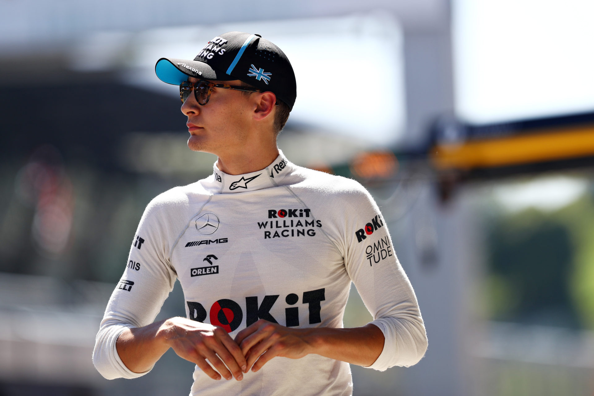 George Russell looks on in his Williams overalls.