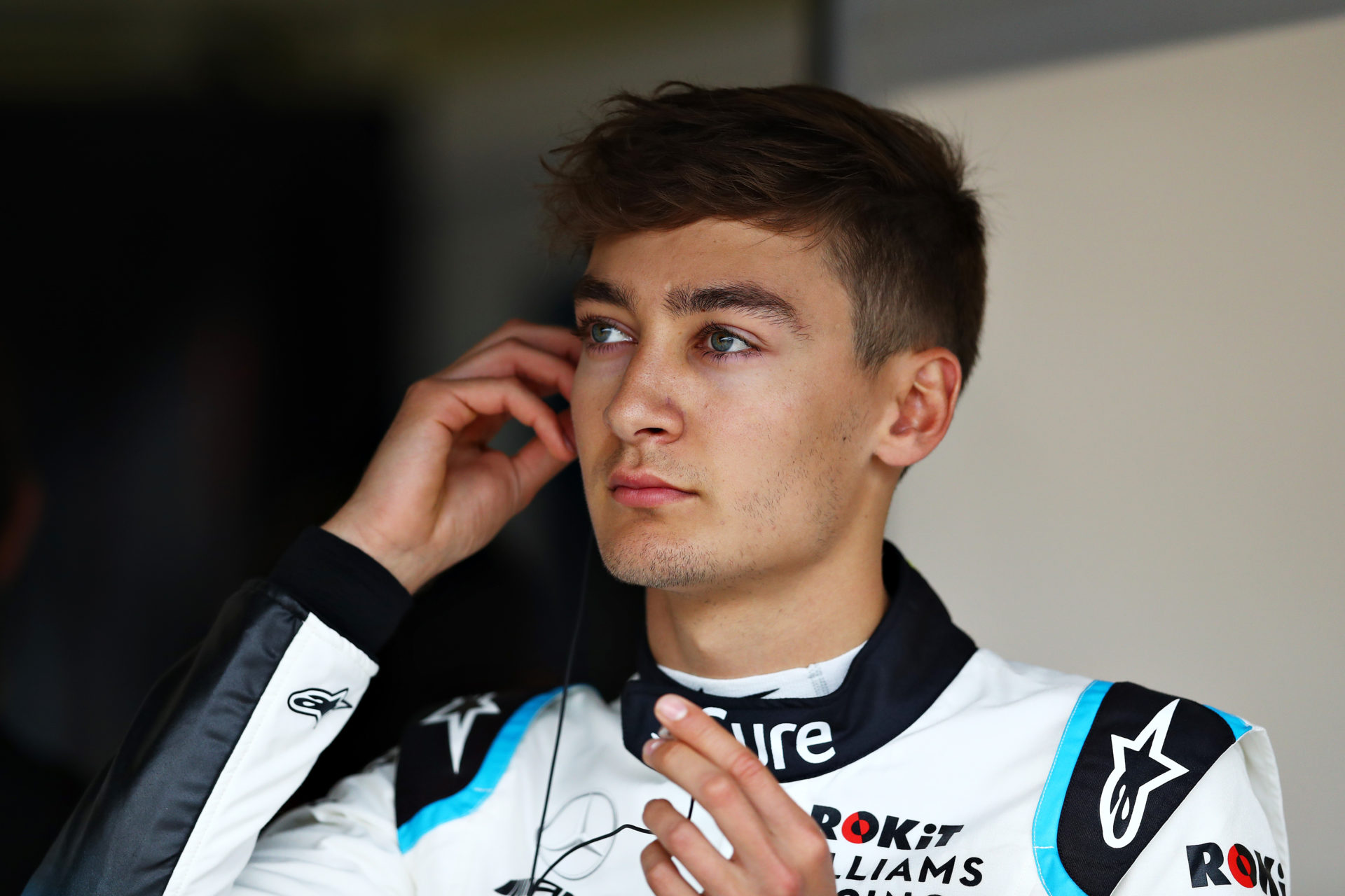 George Russell of Williams looks on