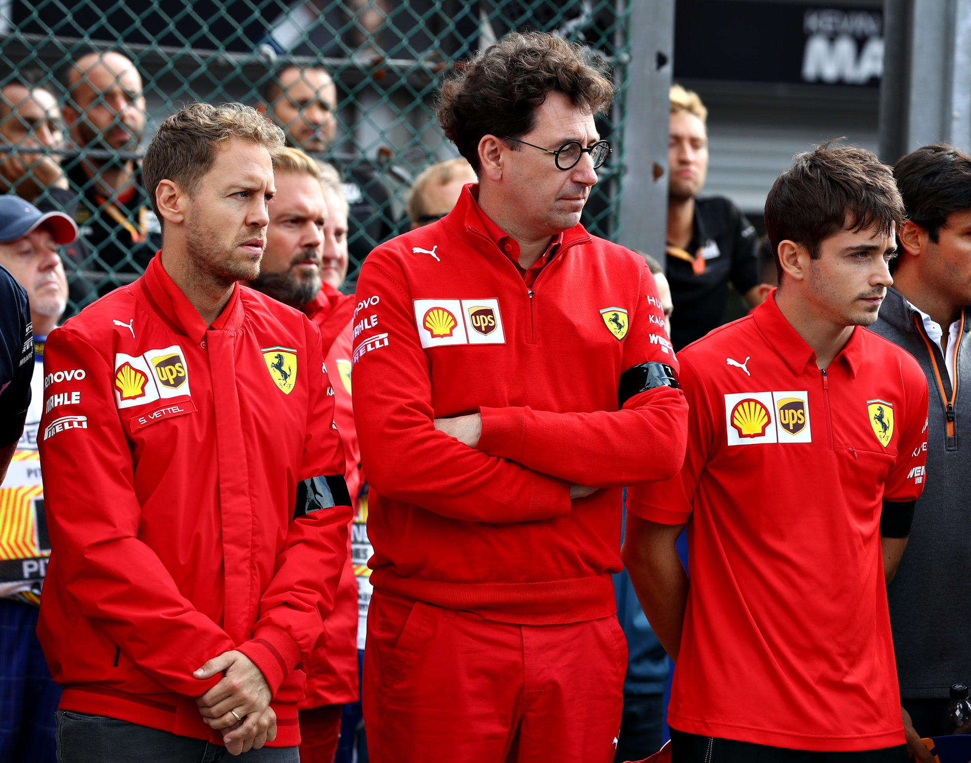 Ferrari drivers Sebastian Vettel and Charles Leclerc with team boss Mattia Binotto look on