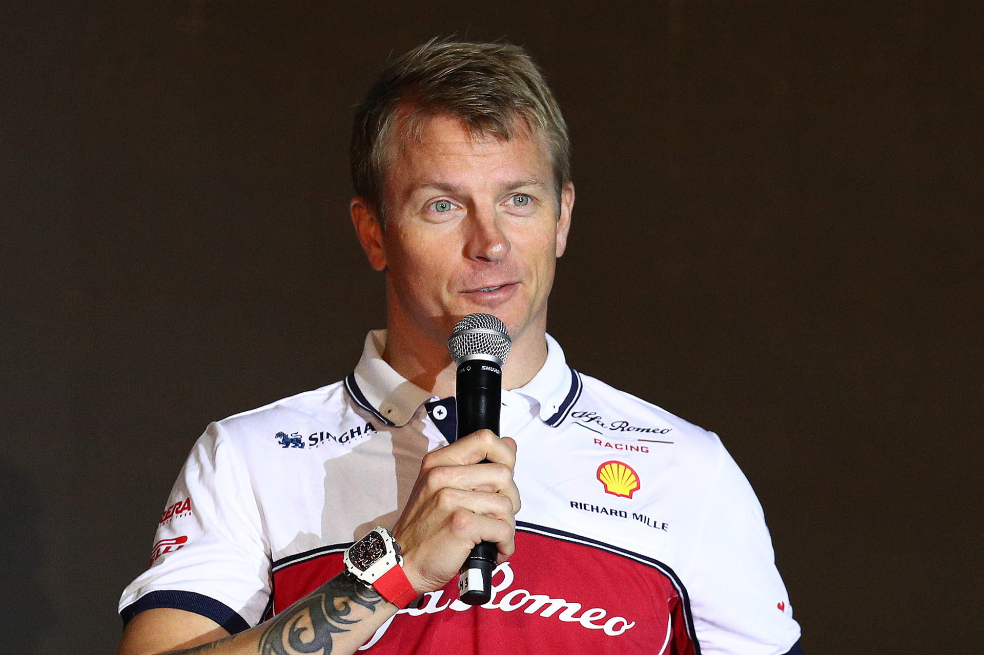 Kimi Raikkonen speaks on stage at the Richard Mille