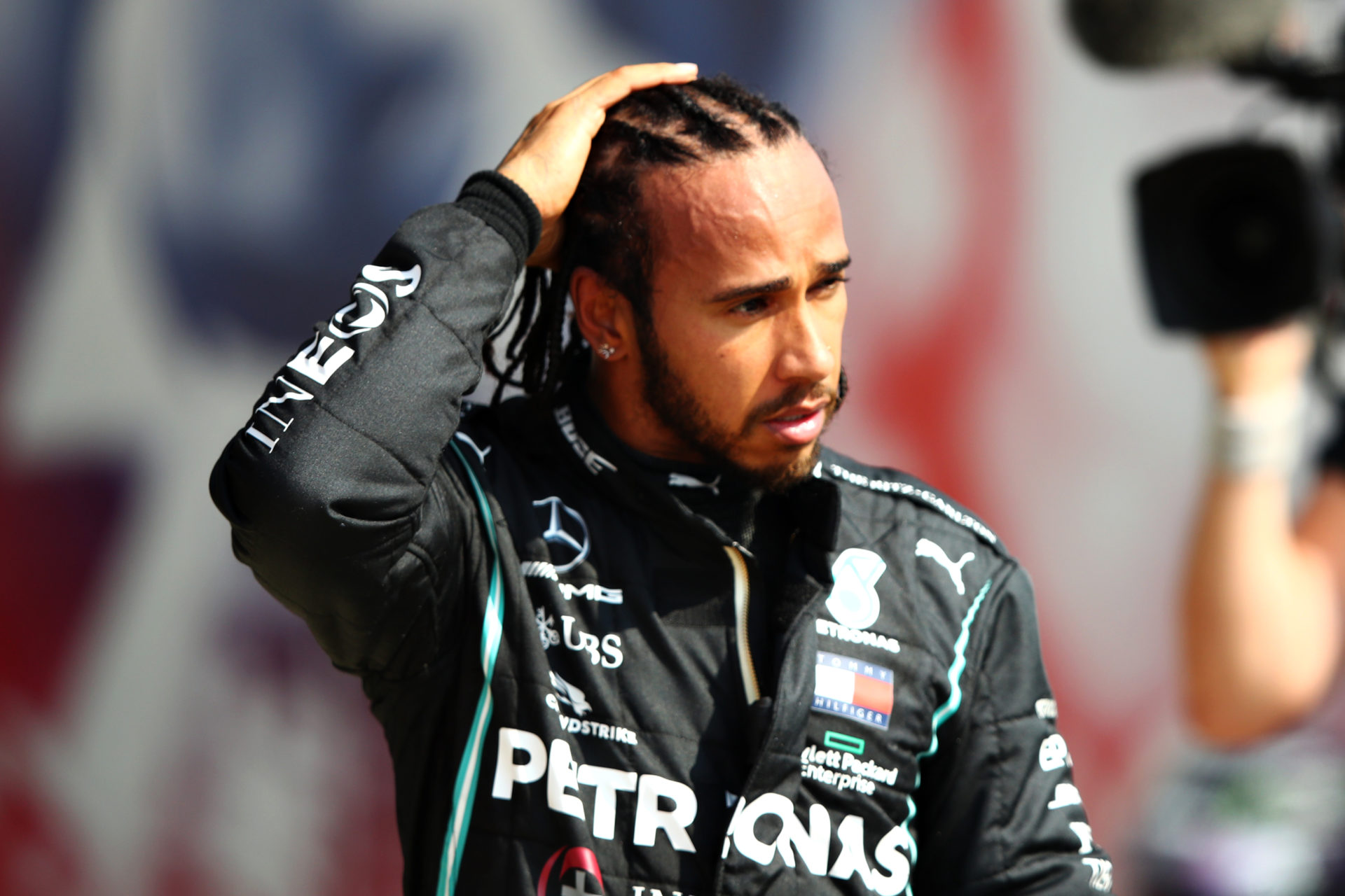 Mercedes' Lewis Hamilton looks on after the 70th anniversary GP race