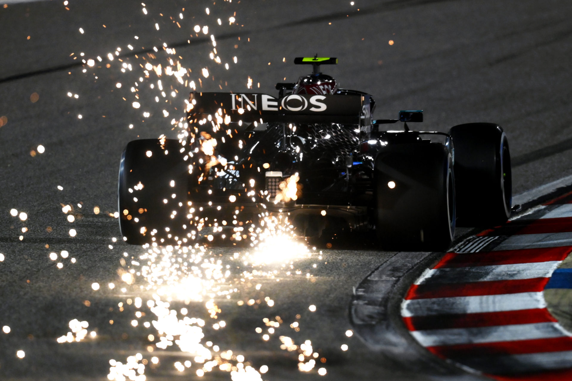 The Mercedes of Valtteri Bottas is trailing sparks in Bahrain