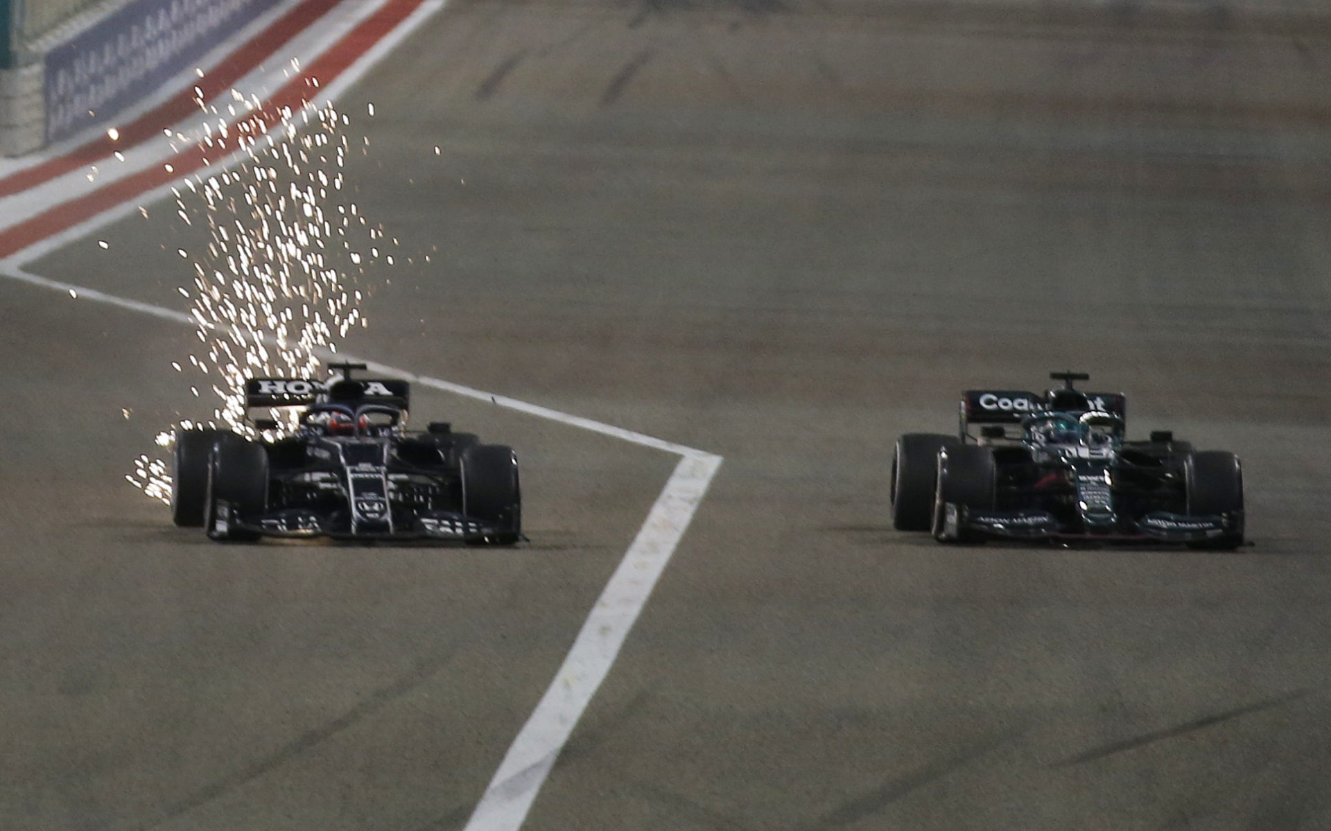 Yuki Tsunoda of AlphaTauri battles Lance Stroll in an Aston Martin