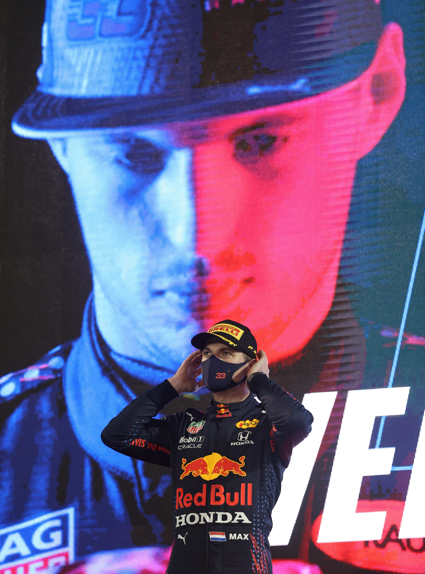 Max Verstappen on the podium alongside Mercedes drivers in Bahrain