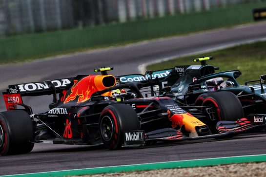 (L to R): Sergio Perez (MEX) Red Bull Racing RB16B and Sebastian Vettel (GER) Aston Martin F1 Team AMR21 battle for position.
18.04.2021. Formula 1 World Championship, Rd 2, Emilia Romagna Grand Prix, Imola, Italy, Race Day.
- www.xpbimages.com, EMail: requests@xpbimages.com &copy; Copyright: Batchelor / XPB Images