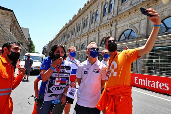 Nikita Mazepin (RUS) Haas F1 Team with marshals.
03.06.2021. Formula 1 World Championship, Rd 6, Azerbaijan Grand Prix, Baku Street Circuit, Azerbaijan, Preparation Day.
- www.xpbimages.com, EMail: requests@xpbimages.com &copy; Copyright: Moy / XPB Images