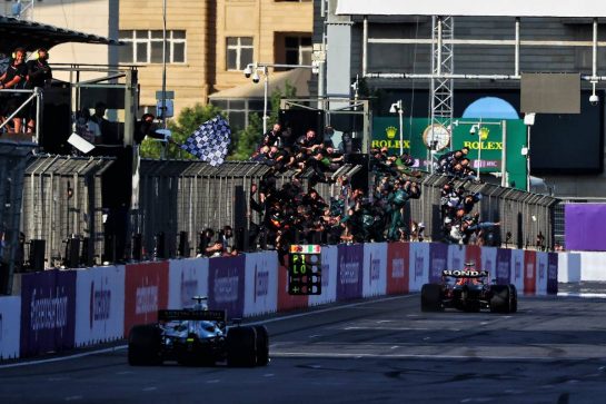 Race winner Sergio Perez (MEX) Red Bull Racing RB16B takes the chequered flag at the end of the race ahead of second placed Sebastian Vettel (GER) Aston Martin F1 Team AMR21.
06.06.2021. Formula 1 World Championship, Rd 6, Azerbaijan Grand Prix, Baku Street Circuit, Azerbaijan, Race Day.
- www.xpbimages.com, EMail: requests@xpbimages.com &copy; Copyright: Moy / XPB Images