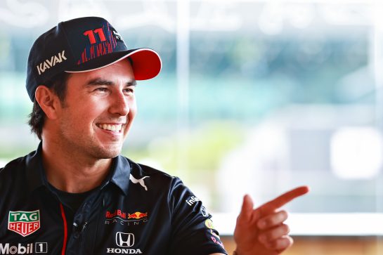 SPIELBERG, AUSTRIA - JULY 01: Sergio Perez of Mexico and Red Bull Racing talks in the Paddock during previews ahead of the F1 Grand Prix of Austria at Red Bull Ring on July 01, 2021 in Spielberg, Austria. (Photo by Mark Thompson/Getty Images) // Getty Images / Red Bull Content Pool // SI202107010155 // Usage for editorial use only //