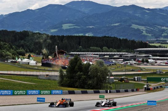 Lando Norris (GBR) McLaren MCL35M and Mick Schumacher (GER) Haas VF-21.
02.07.2021. Formula 1 World Championship, Rd 9, Austrian Grand Prix, Spielberg, Austria, Practice Day.
- www.xpbimages.com, EMail: requests@xpbimages.com © Copyright: Batchelor / XPB Images