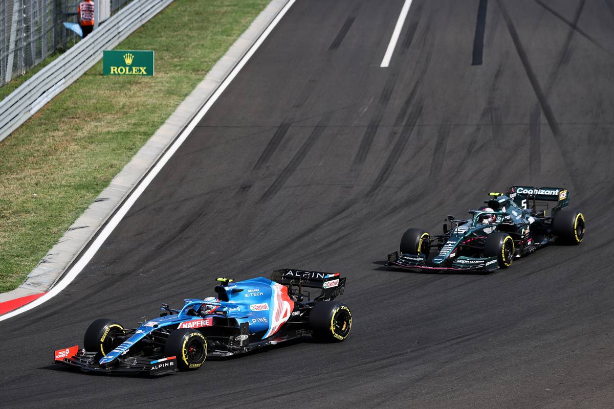 Esteban Ocon (FRA) Alpine F1 Team A521 leads Sebastian Vettel (GER) Aston Martin F1 Team AMR21. 01.08.2021. Formula 1 World Championship, Rd 11, Hungarian Grand Prix, Budapest