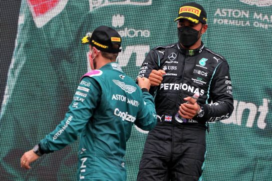 Sebastian Vettel (GER) Aston Martin F1 Team celebrates his second position on the podium with third placed Lewis Hamilton (GBR) Mercedes AMG F1.
01.08.2021. Formula 1 World Championship, Rd 11, Hungarian Grand Prix, Budapest, Hungary, Race Day.
- www.xpbimages.com, EMail: requests@xpbimages.com &copy; Copyright: Moy / XPB Images