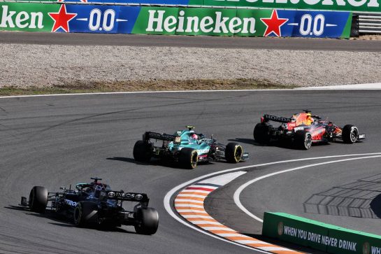 Max Verstappen (NLD) Red Bull Racing RB16B leads Sebastian Vettel (GER) Aston Martin F1 Team AMR21 and Lewis Hamilton (GBR) Mercedes AMG F1 W12.
05.09.2021. Formula 1 World Championship, Rd 13, Dutch Grand Prix, Zandvoort, Netherlands, Race Day.
- www.xpbimages.com, EMail: requests@xpbimages.com © Copyright: Batchelor / XPB Images