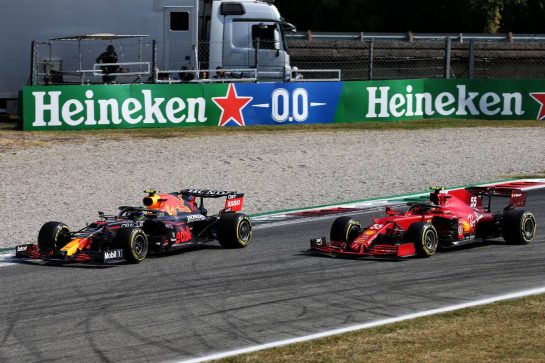 (L to R): Carlos Sainz Jr (ESP) Ferrari SF-21 and Sergio Perez (MEX) Red Bull Racing RB16B battle for position.
12.09.2021. Formula 1 World Championship, Rd 14, Italian Grand Prix, Monza, Italy, Race Day.
- www.xpbimages.com, EMail: requests@xpbimages.com &copy; Copyright:  XPB Images