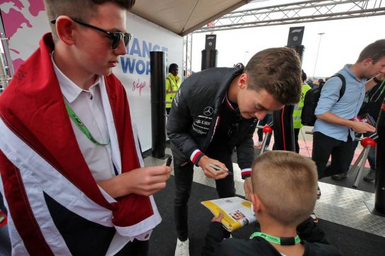 George Russell (GBR) Mercedes AMG F1 signs autographs for the fans.
01.07.2022. Formula 1 World Championship, Rd 10, British Grand Prix, Silverstone, England, Practice Day.
 - www.xpbimages.com, EMail: requests@xpbimages.com &copy; Copyright: Coates / XPB Images