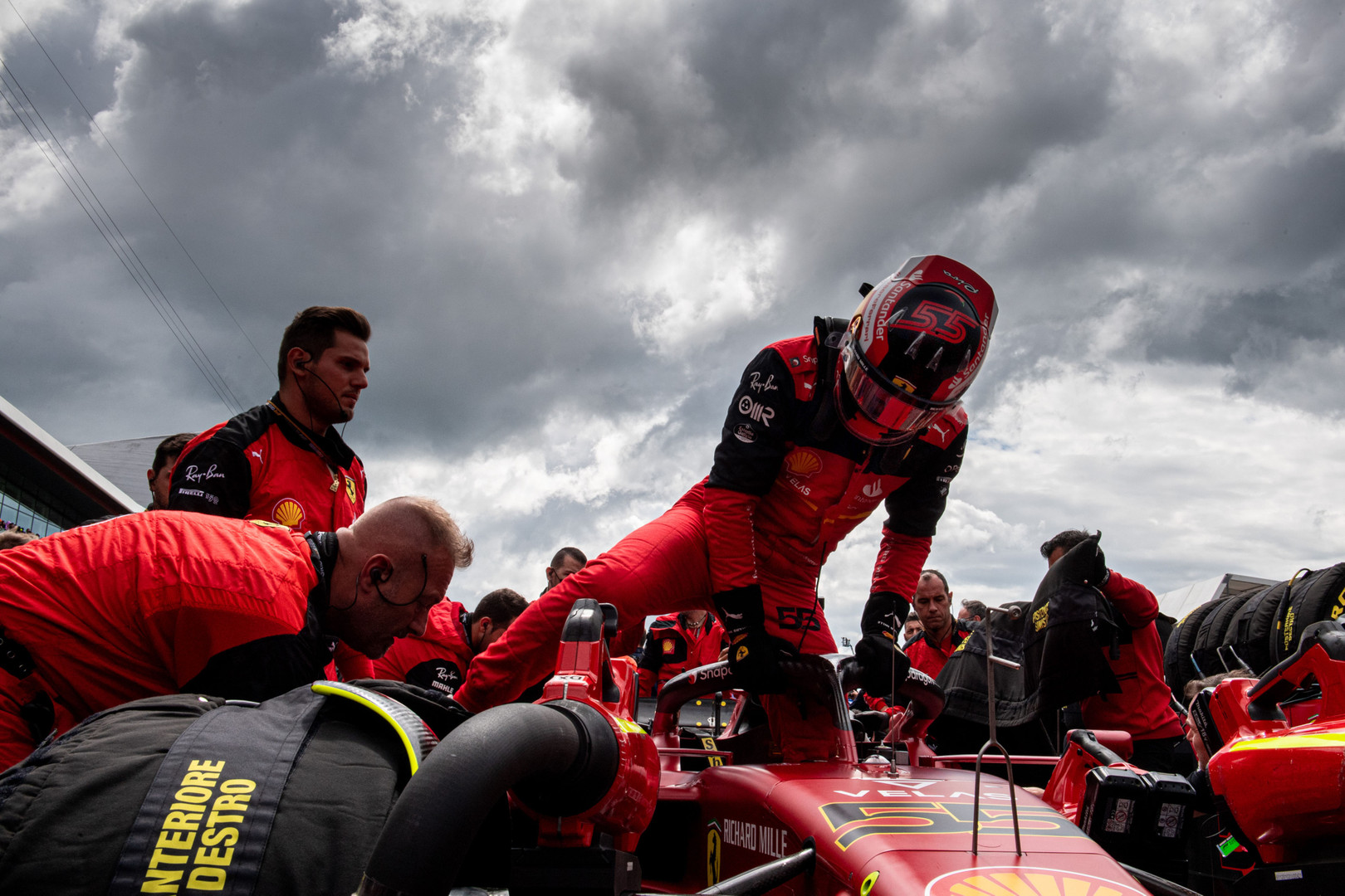 Sainz turned away from TV screens showing Zhou crash