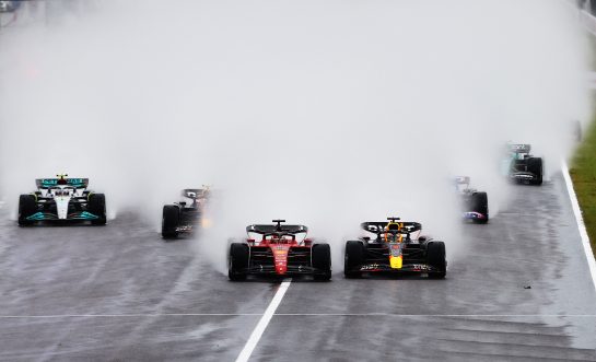 SUZUKA, JAPAN - OCTOBER 09: Max Verstappen of the Netherlands driving the (1) Oracle Red Bull Racing RB18 and Charles Leclerc of Monaco driving the (16) Ferrari F1-75 battle for track position into turn one at the start during the F1 Grand Prix of Japan at Suzuka International Racing Course on October 09, 2022 in Suzuka, Japan. (Photo by Mark Thompson/Getty Images ) // Getty Images / Red Bull Content Pool // SI202210090154 // Usage for editorial use only //