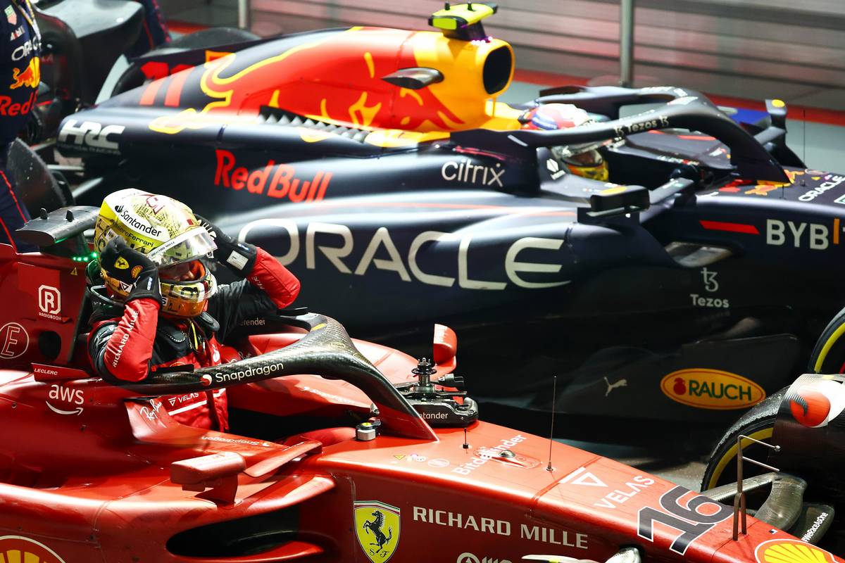 2nd place Charles Leclerc (MON) Ferrari F1-75 with 1st place Sergio Perez (MEX) Red Bull Racing RB18. 02.10.2022. Formula 1 World Championship, Rd 17, Singapore Grand Prix, Marina Bay Street Circuit, Singapore, Race