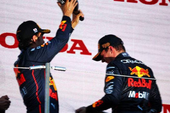 Race winner Max Verstappen (NLD) Red Bull Racing celebrates on the podium with team mate Sergio Perez (MEX) Red Bull Racing.
09.10.2022. Formula 1 World Championship, Rd 18, Japanese Grand Prix, Suzuka, Japan, Race Day.
 - www.xpbimages.com, EMail: requests@xpbimages.com &copy; Copyright: Coates / XPB Images