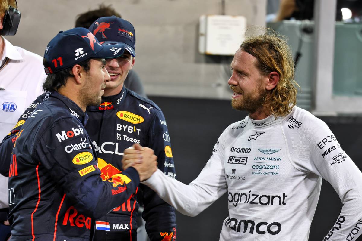 Sergio Perez (MEX) Red Bull Racing with Max Verstappen (NLD) Red Bull Racing and Sebastian Vettel (GER) Aston Martin F1 Team in parc ferme. 20.11.2022. Formula 1 World Championship, Rd 22, Abu Dhabi Grand Prix, Yas Marina Circuit, Abu Dhabi, Race