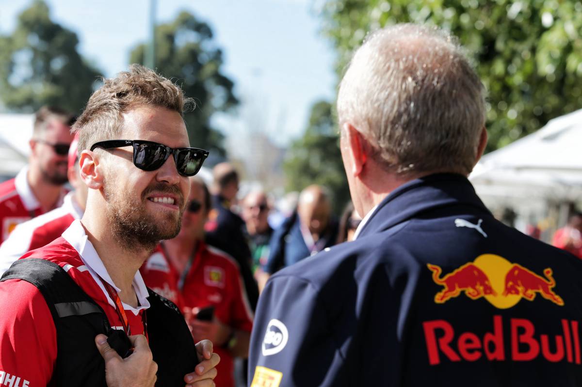 Sebastian Vettel (GER) Ferrari with Dr Helmut Marko (AUT) Red Bull Motorsport Consultant. 24.03.2017. Formula 1 World Championship, Rd 1, Australian Grand Prix, Albert Park, Melbourne, Australia, Practice