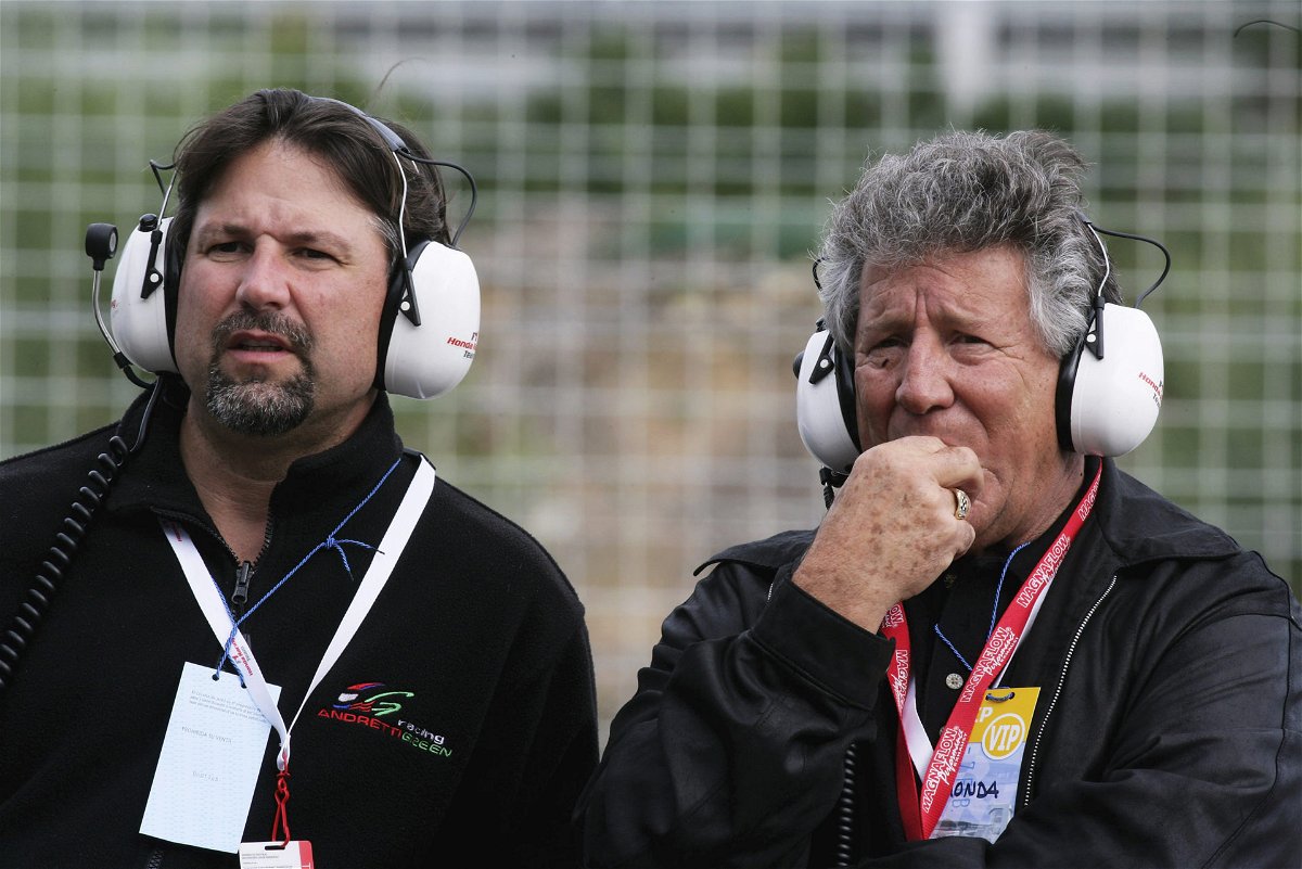 Former F1 driver Mario Andretti, with his son Michael Andretti
