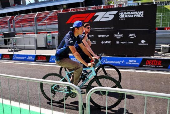 Alexander Albon (THA) Atlassian Williams Racing rides the circuit with Russell Paddon (GBR) Atlassian Williams Racing.
31.07.2025. Formula 1 World Championship, Rd 14, Hungarian Grand Prix, Budapest, Hungary, Preparation Day.
- www.xpbimages.com, EMail: requests@xpbimages.com © Copyright: Batchelor / XPB Images