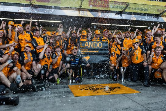 ABU DHABI, UNITED ARAB EMIRATES - DECEMBER 07: 2025 F1 World Drivers Champion Lando Norris of Great Britain and McLaren celebrates with his team during the F1 Grand Prix of Abu Dhabi at Yas Marina Circuit on December 07, 2025 in Abu Dhabi, United Arab Emirates. (Photo by Andrew Ferraro/LAT Images)